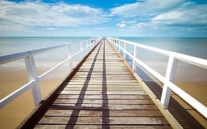 Image shows a jetty stretching off to the horizon.