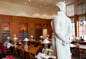Image shows Tulane University Law School library, filled with students.