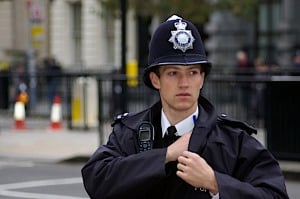 Image shows a British police officer.