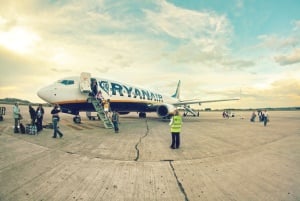 Image shows a Ryanair plane on the ground.
