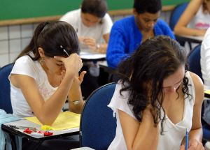 Image shows students sitting an exam.