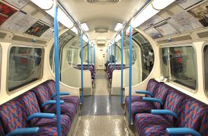 Image shows the inside of a London Underground carriage.