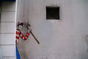 Image shows graffiti of Waldo. 