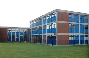 Image shows a 60s comprehensive school building.