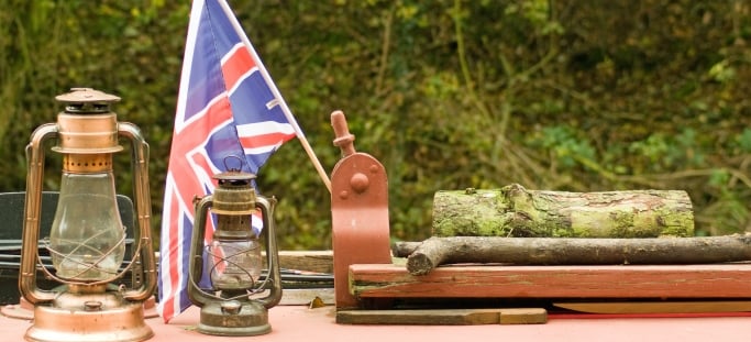 Image shows a Union Jack flying on top of a canal boat. 