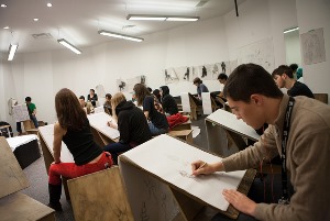 Image shows a life drawing class.