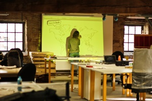 Image shows someone designing a world map.