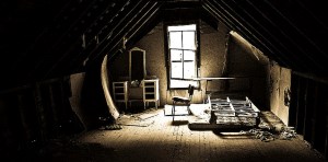 Image shows an old, dusty attic room.