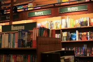Image shows rows of bookshop shelves.