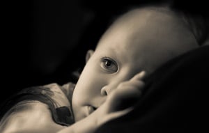 Image shows a baby thinking.