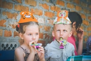 Children with party blowers
