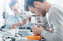 Students wiring components - Engineering summer school