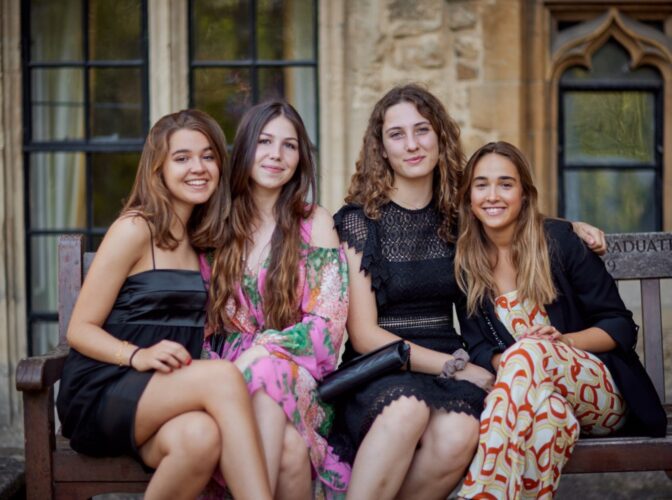 Yale summer school, join exciting activities and trips, group of girls smiling at a formal graduation party.