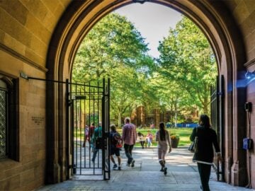 Yale summer school, experience life at Yale University, gate onto quad with lush green lawns.