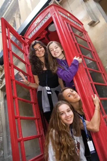 London Summer School students in the iconic red phone box