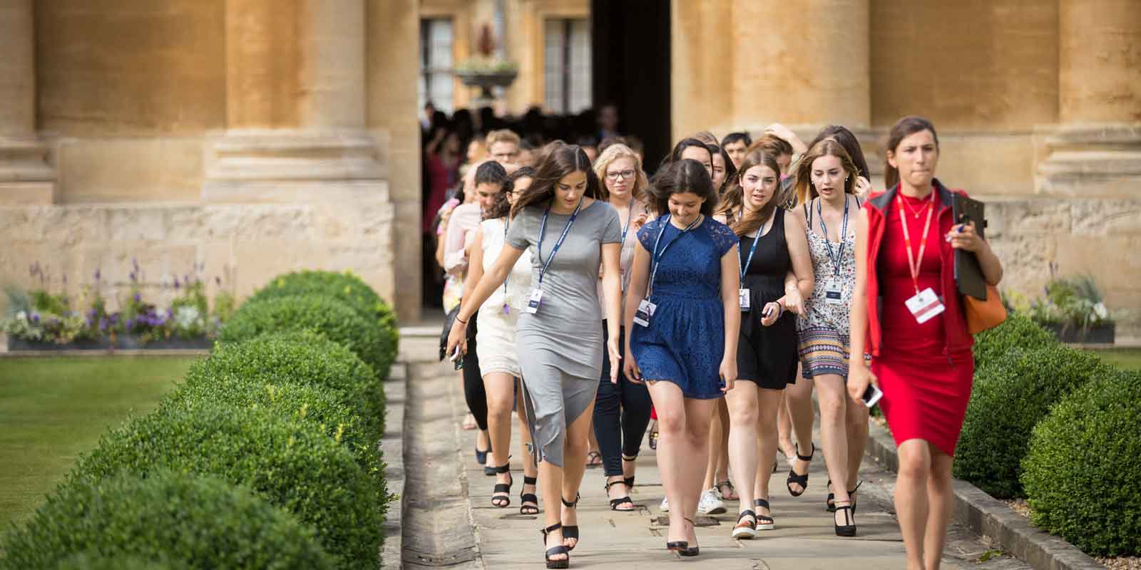 Girls at Queens College Oxford walking to graduation